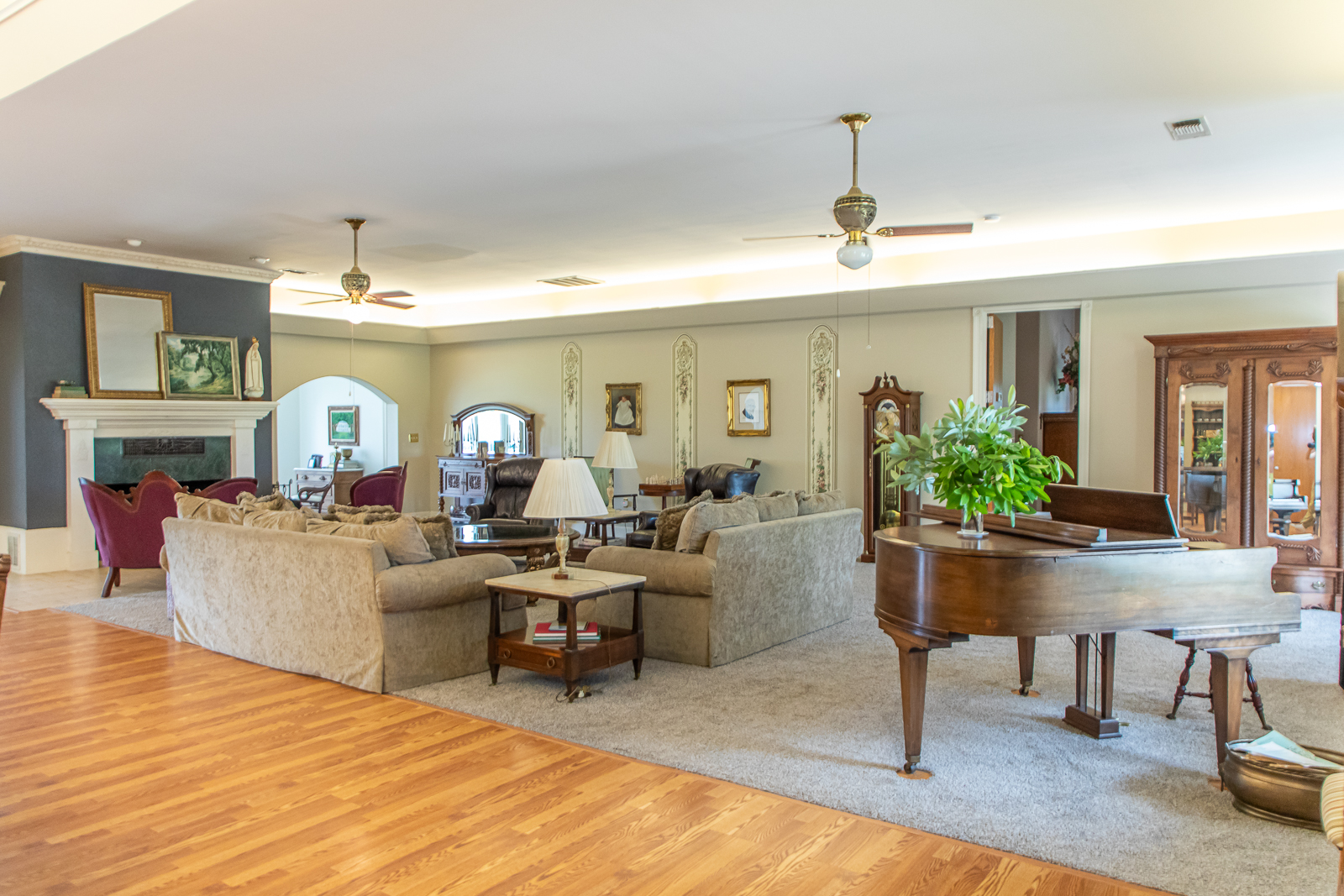 The Farm At Hickory Creek, Large living room with hearth, couches, and piano