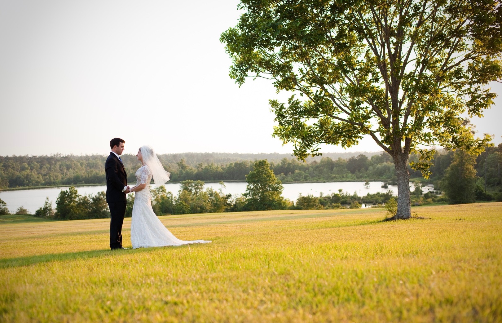 wedding couple in field at Farm at Hickory Creek