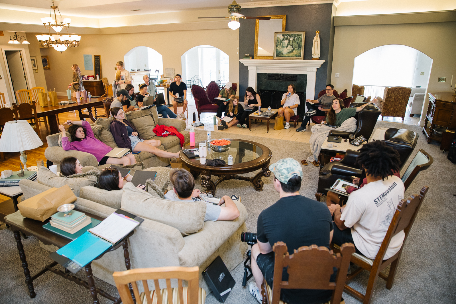 group of people socializing in the living room